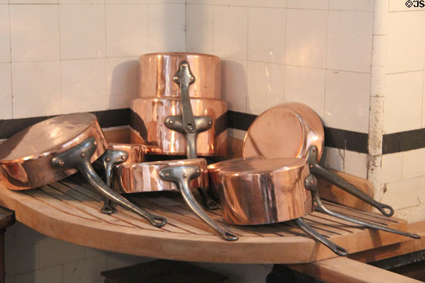 Copper pans on drain board in kitchen at Nissim de Camondo Museum. Paris, France.