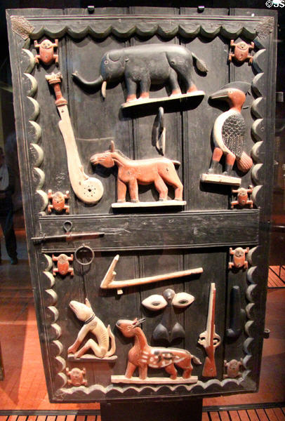 Carved wooden gate of royal palace of king of Glèlè (c1880-9) from Abomey, Benin at Musée du quai Branly. Paris, France.
