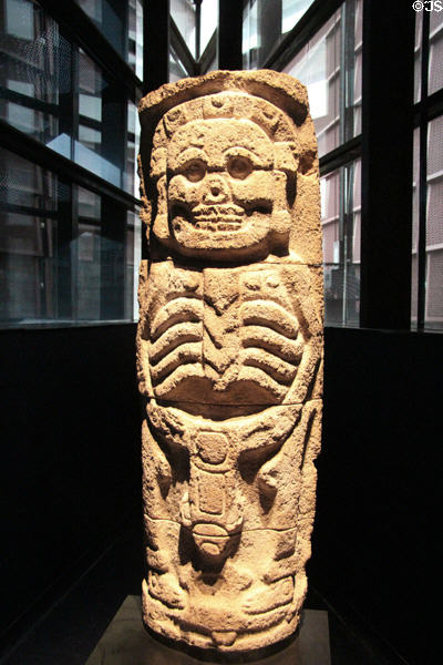 Stone statue column of death skeleton (800-1000) from Yucatan, Mexico at Musée du quai Branly. Paris, France.