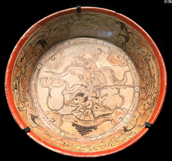 Terra cotta plate painted with man in aquatic setting (600 - 800) from Calakmul, Mexico at Musée du quai Branly. Paris, France.