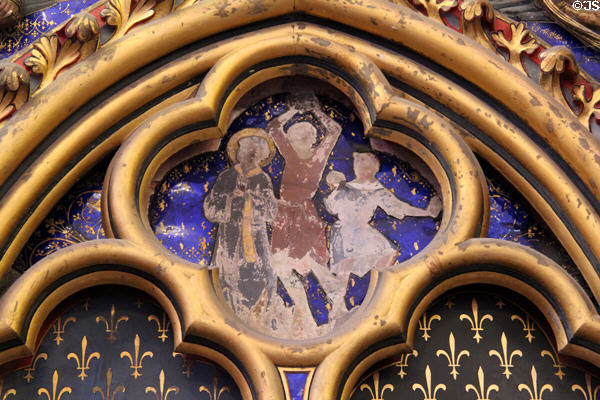 Painted biblical scene in Gothic tetrafoil (13thC) surrounded by Fleur-de-Lys at St Chapelle. Paris, France.