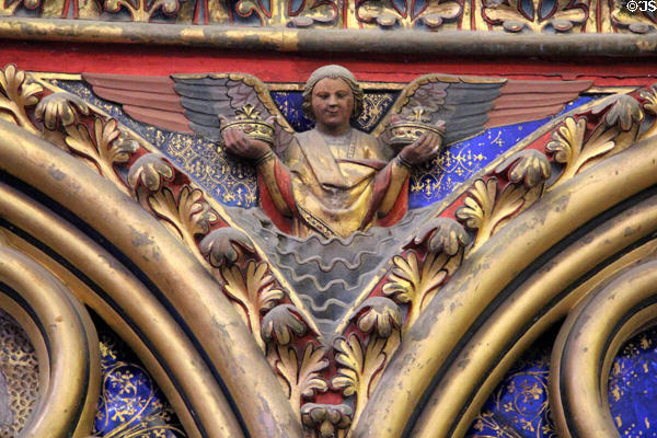 Painted angel holding royal crowns (13thC) at St Chapelle. Paris, France.