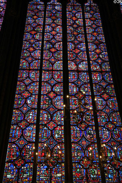 Stained glass with scenes of royal history at St Chapelle. Paris, France.