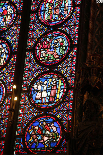 Stained glass with scenes of knightly combat at St Chapelle. Paris, France.