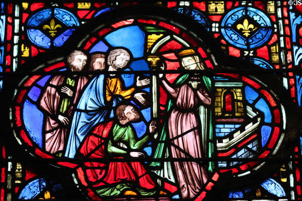 Bowing to Queen on castle stained glass scene at St Chapelle. Paris, France.