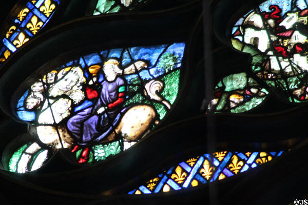 Multi-headed monster scene of rose window at St Chapelle. Paris, France.