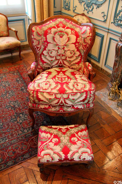 Walnut armchair & footstool (Regency period) upholstered with 18thC designs at Carnavalet Museum. Paris, France.