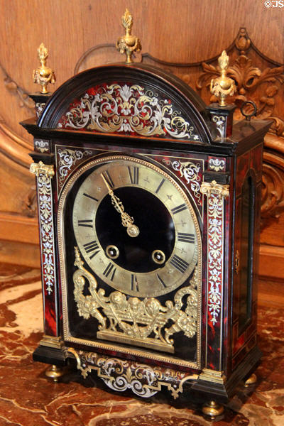 Table clock (17thC) decorated with inlaid tortoise shell and metal from France at Carnavalet Museum. Paris, France.