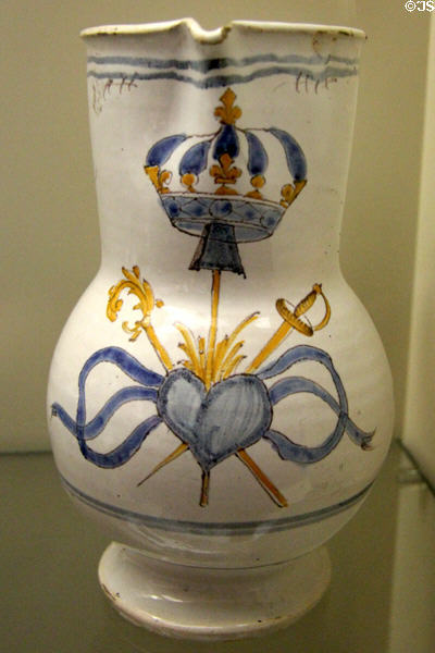 Earthenware pitcher (c1789) painted with the ardent heart made by Faïence de Never at Carnavalet Museum. Paris, France.