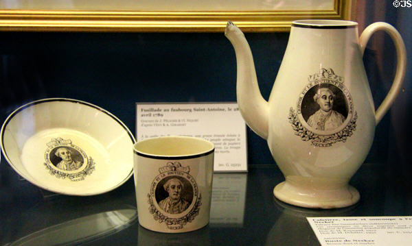 Earthenware coffee pot, cup & saucer with portrait of Jacques Necker, highly regarded finance minister for Louis XVI & inscription "the hope & support of France" by unknown maker at Carnavalet Museum. Paris, France.