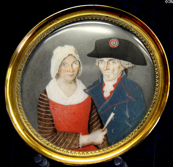 Elderly couple in Revolutionary dress with rosettes painting on ivory at Carnavalet Museum. Paris, France.