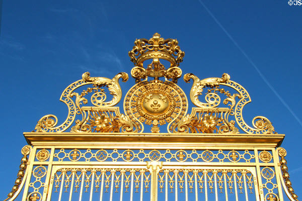 Upper detail of Royal Court gilded gates at Versailles Palace. Versailles, France.