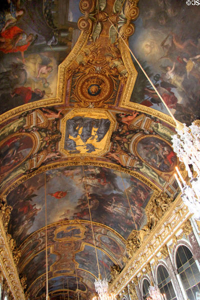 Ceiling painting by Charles Le Brun in Hall of Mirrors at Versailles Palace. Versailles, France.