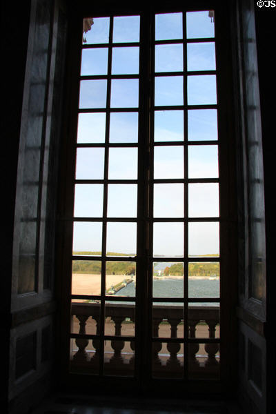 View of gardens from Hall of Mirrors at Versailles Palace. Versailles, France.