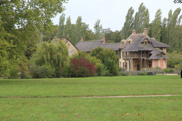 Rustic buildings of Marie Antoinette farm (Hameau de la Reine) where French Queen replicated rural life of her native Austria to escape complexities of Versailles Palace. Versailles, France.