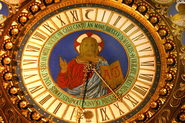 Clock face with image of Jesus Christ & ornate clock hands on Astronomical Clock at Cathédrale St-Pierre. Beauvais, France.