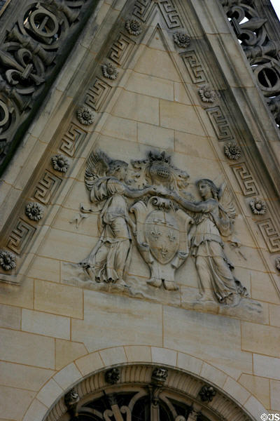 Royal crest with fleur-de-lis on chapel at Château de Chantilly. Chantilly, France.
