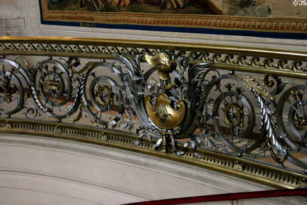 Wrought iron staircase railing in Hall of Honor at Château de Chantilly. Chantilly, France.