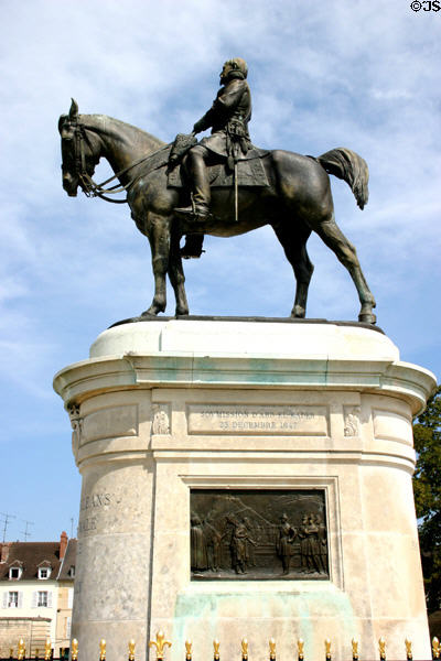 Equestrian statue of Duke of Aumale, aka Henri of Orleans, builder of the Grand Château, accepting 1847 surrender of Emir Abdel Kadar of Algeria next to Grand Stables at Château de Chantilly. Chantilly, France.