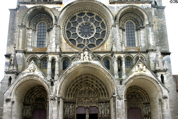 Deep porches with Last Judgment topped by statues & rose window of Cathédrale Notre-Dame. Laon, France.