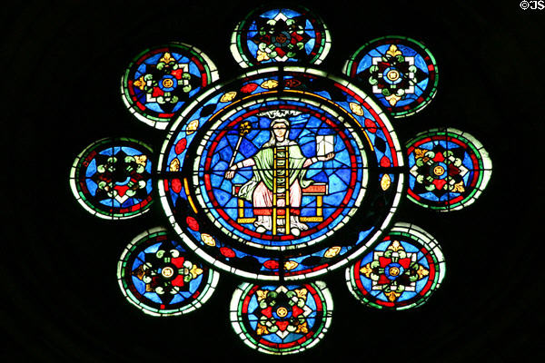 Central medallion of north rose window which represents liberal arts of the time at Cathédrale Notre-Dame. Laon, France.