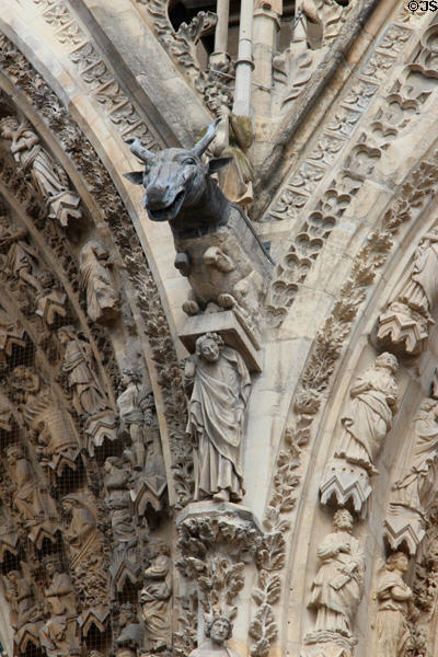 Moose-like beast supported by human figure on Reims Cathedral. Reims, France.