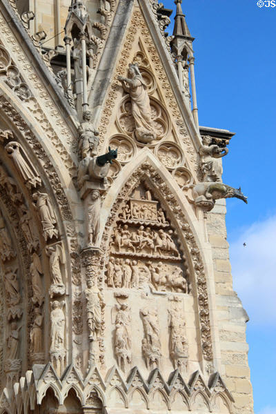Gargoyles & other carvings projecting from facade of Reims Cathedral. Reims, France.