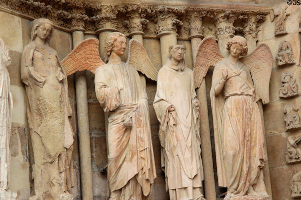 "Smiling Angel" (far right) & other figures on facade of Reims Cathedral. Reims, France.