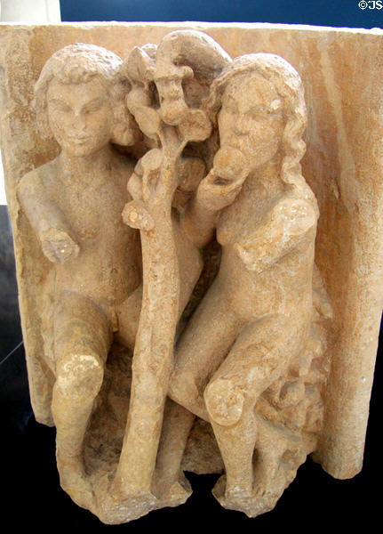 Original Sin represented by Adam & Eve, a serpent & an apple statue at Tau Palace Museum. Reims, France.
