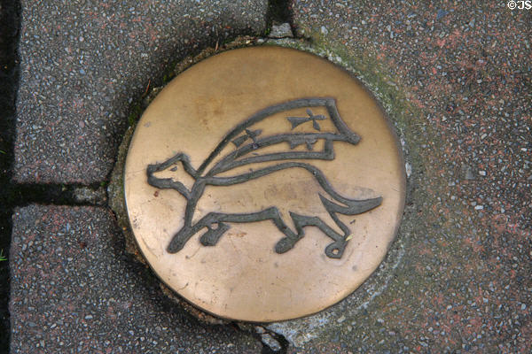 Royal ermine with cape on brass plaque on sidewalk. Auray, France.