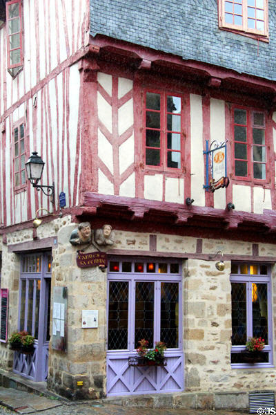 Half-timbered building with carved figures on rue Bienheureux Pierre René Rogues. Vannes, France.