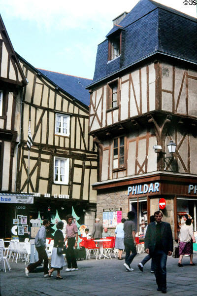 Half-timbered buildings over street activity. Vannes, France.