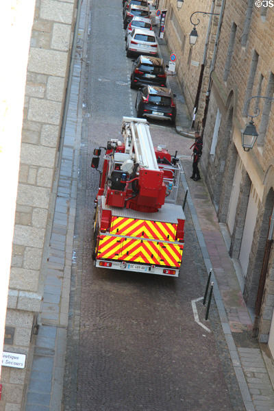 Fire truck squeezing along narrow street. St Malo, France.