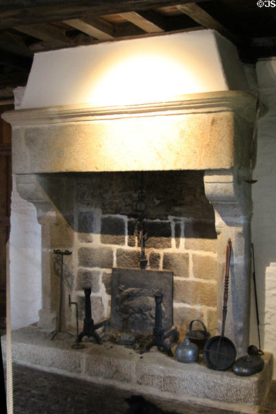 Small fireplace with heat reflecting iron plate in Cartier's bedroom at Jacques Cartier Manor House Museum. St Malo, France.