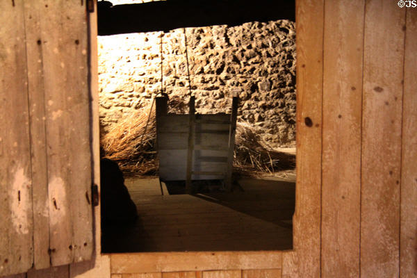 View from kitchen, original part of one room house, into barn at Jacques Cartier Manor House Museum. St Malo, France.