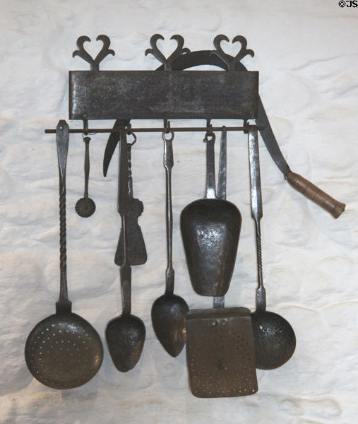 Iron cooking utensils in kitchen at Jacques Cartier Manor House Museum. St Malo, France.