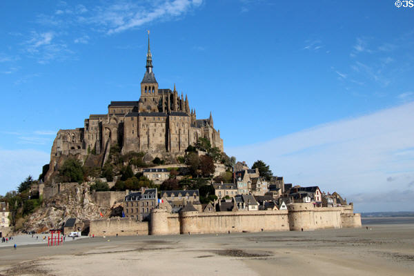 Mont-St-Michel surrounded by tidal flats at low tide. Mont-St-Michel, France.