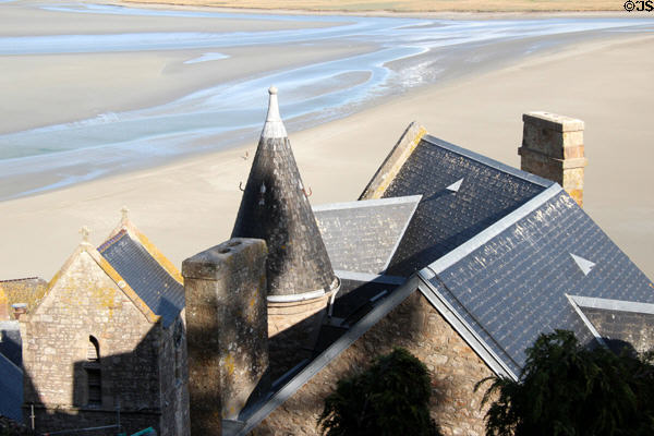 Looking down on varied roofs of Mont-St-Michel above tidal flats. Mont-St-Michel, France.