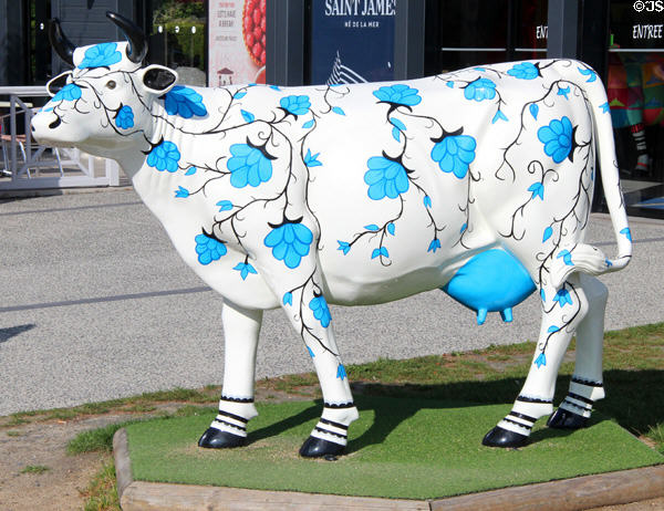 Painted cow in town of La Caserne, gateway to Mont-St-Michel. Mont-St-Michel, France.