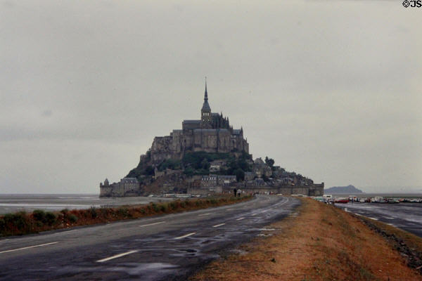 Former (until 2015) causeway access to Mont-St-Michel with risky parking lots on tidal flats. Mont-St-Michel, France.