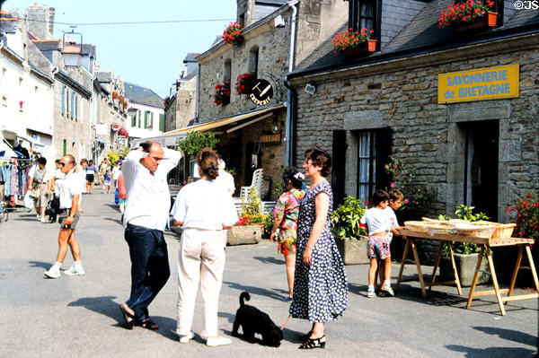 Visitors enjoying stroll around old town. Concarneau, France.