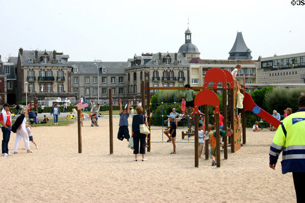 Children playing in city park near ocean. Dieppe, France.