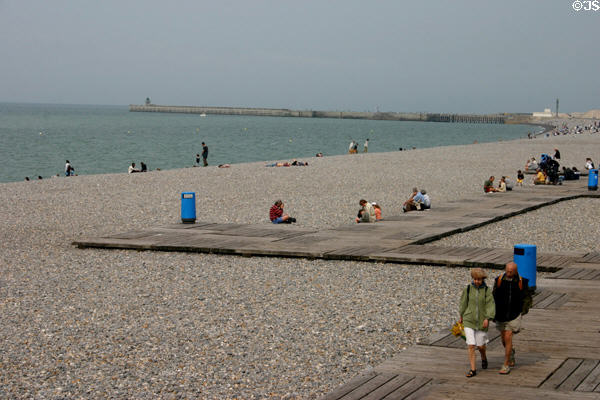 Wide beach ending at ferry port. Dieppe, France.