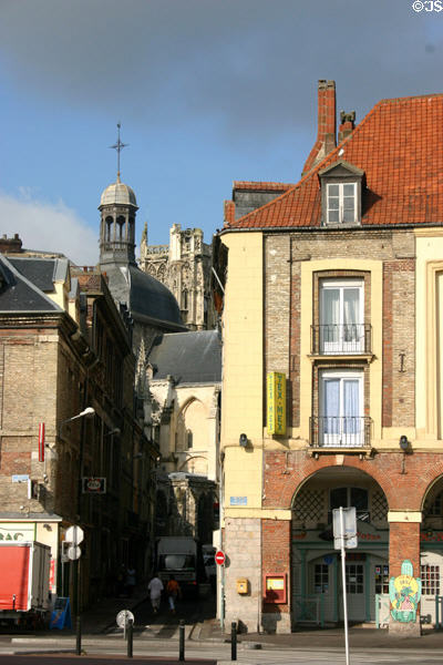 Lantern tower with dome of Church of St Jacques in sunshine seen down alley. Dieppe, France.