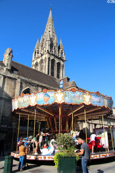 Carrousel in front of St Sauveur church (14thC). Caen, France.