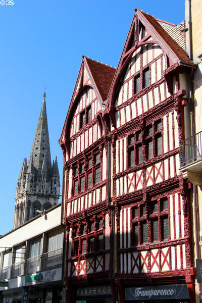 Half-timbered house (16thC) on St-Pierre Street with spire of St Sauveur church beyond. Caen, France.