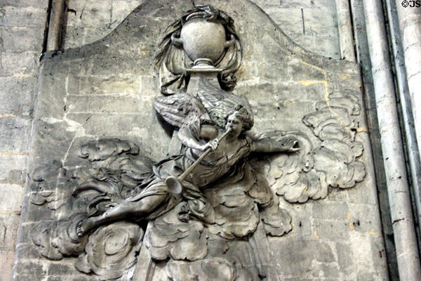 Carving of Angel Gabriel blowing his horn on Amiens Cathedral. Amiens, France.