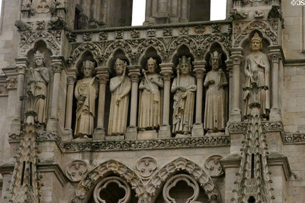 Left side of Kings' Gallery with life-sized figures on front of Amiens Cathedral. Amiens, France.