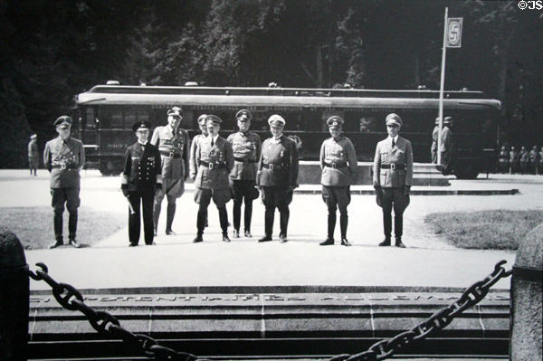 Photo of Hitler & German delegation standing in clearing after having reading of German conditions to French delegation at Armistice Rail Car Museum. Compiègne, France.