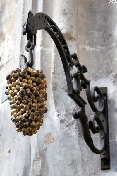 Wrought iron shop sign holding grapes (18thC) from Paris at Wrought Iron Museum. Rouen, France.